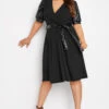 YOURS LONDON Curve Black Leather Look Puff Sleeve Wrap Dress 1 YOURS LONDON Curve Black Leather Look Puff Sleeve Wrap Dress -Plus Size Apparel Shop 3bdf1880 adc3 4f 161752 A